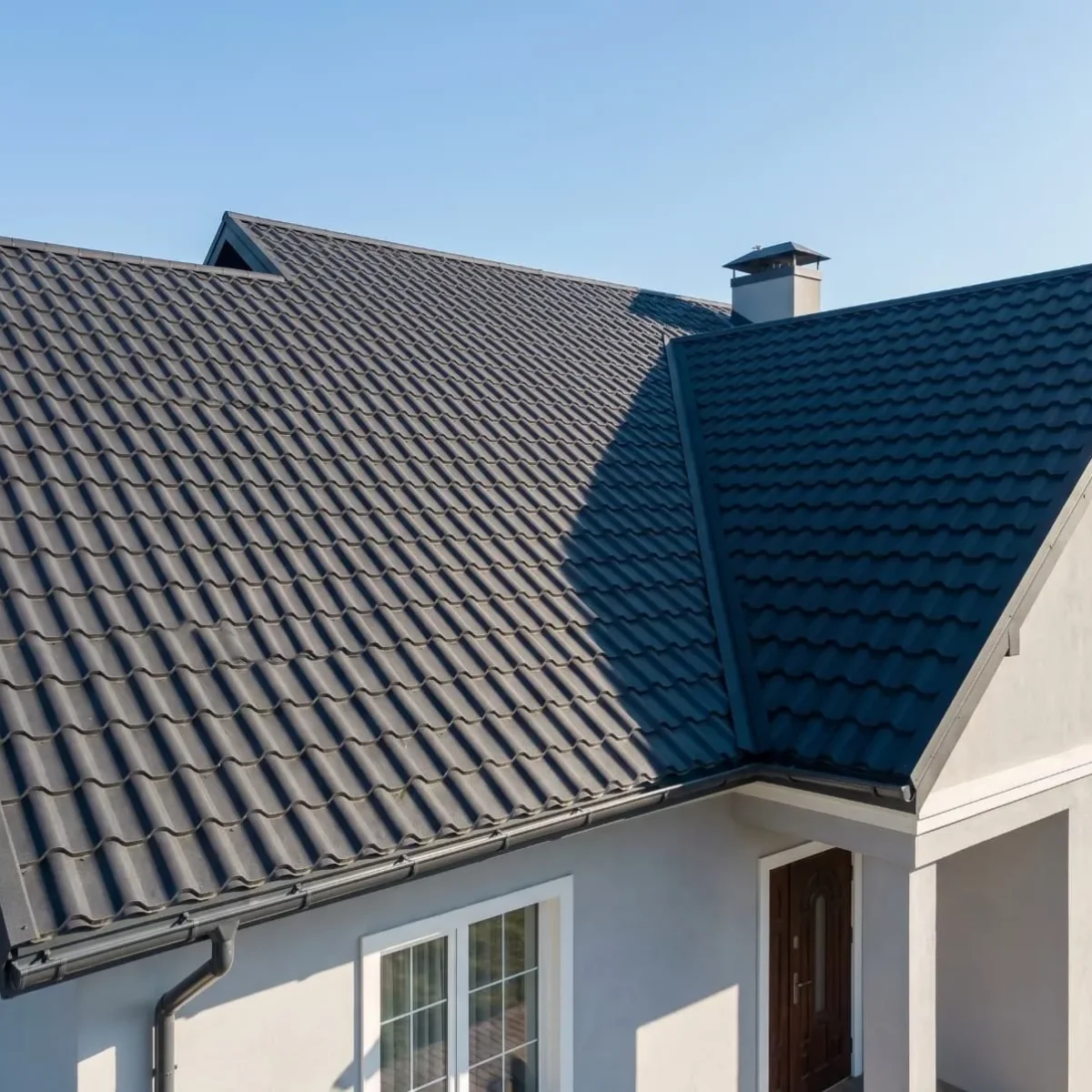 Clean finished appearance of a visible villa roofline utilizing YG Panels tile-look metal roofing panels with proper minimum slope