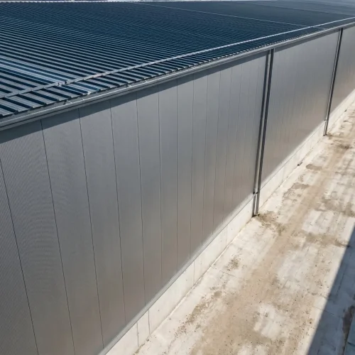 assive steel-structure warehouse featuring YG wall panels and deep-ribbed roofing sheets for extreme coverage efficiency